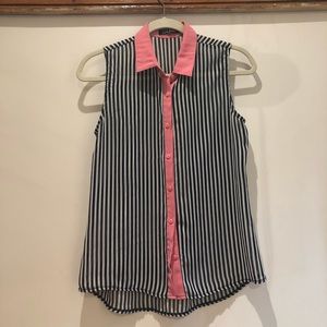 Sleeveless, sheer button down blouse.